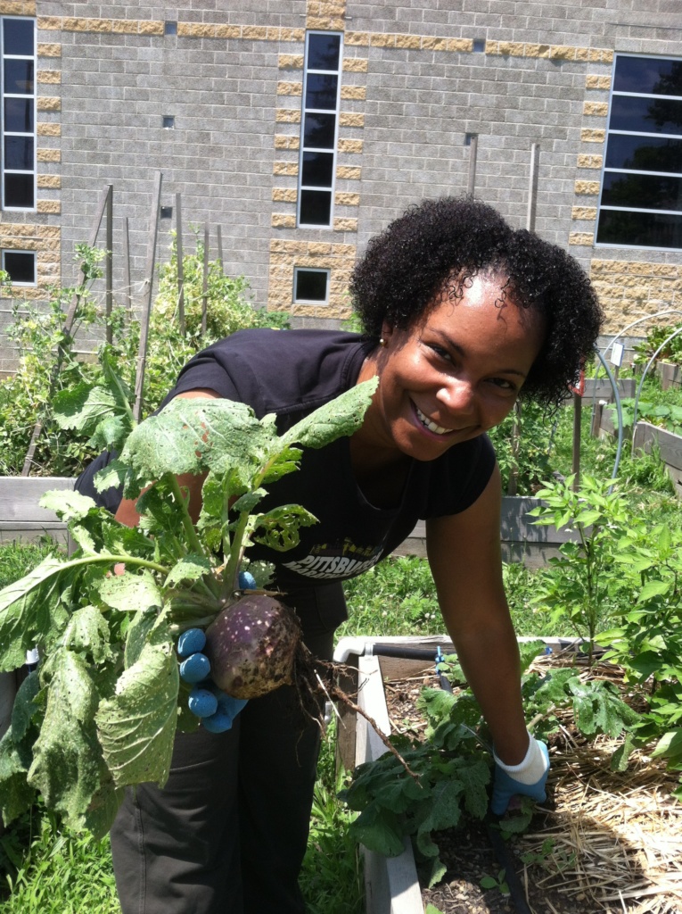 Harvesting from a raised bed at the Homewood Brushton YMCA.