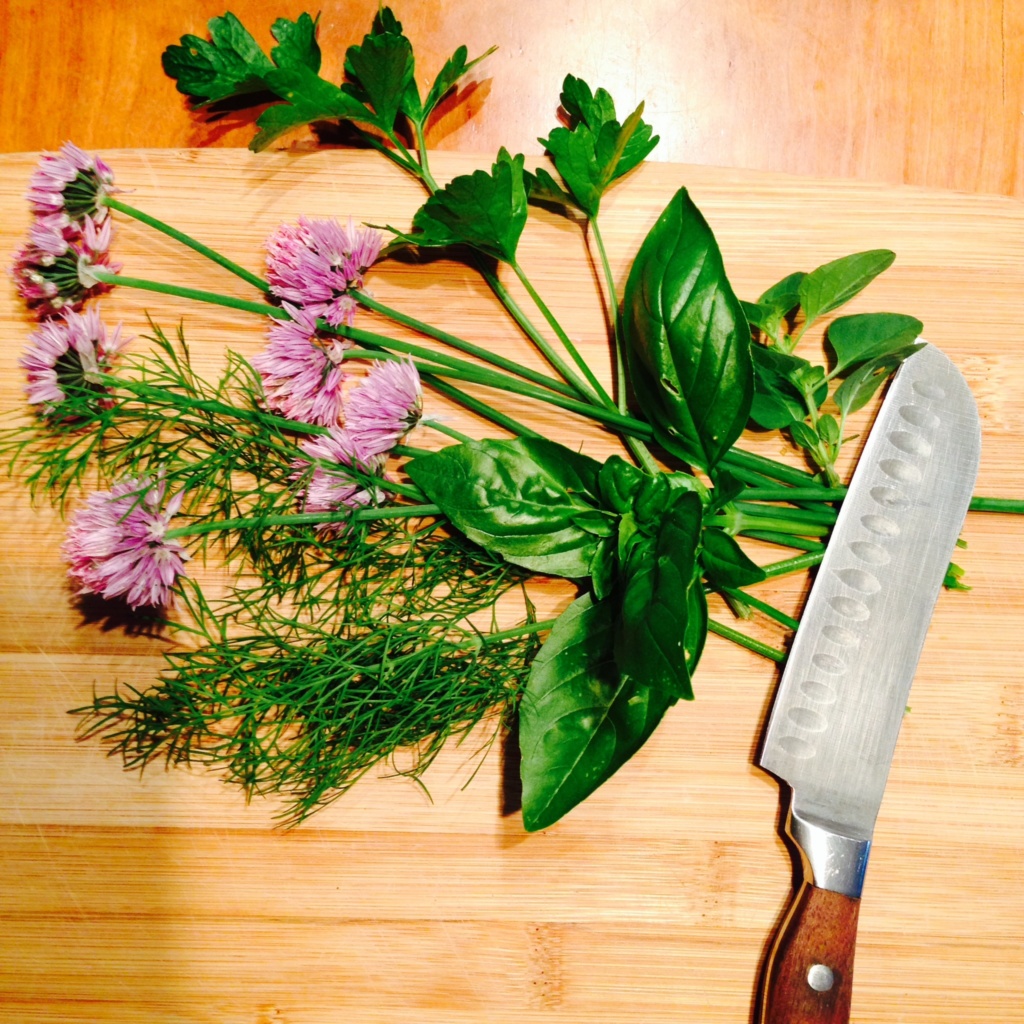 Preparing herbs to dry, freeze, or chop for herb butter.